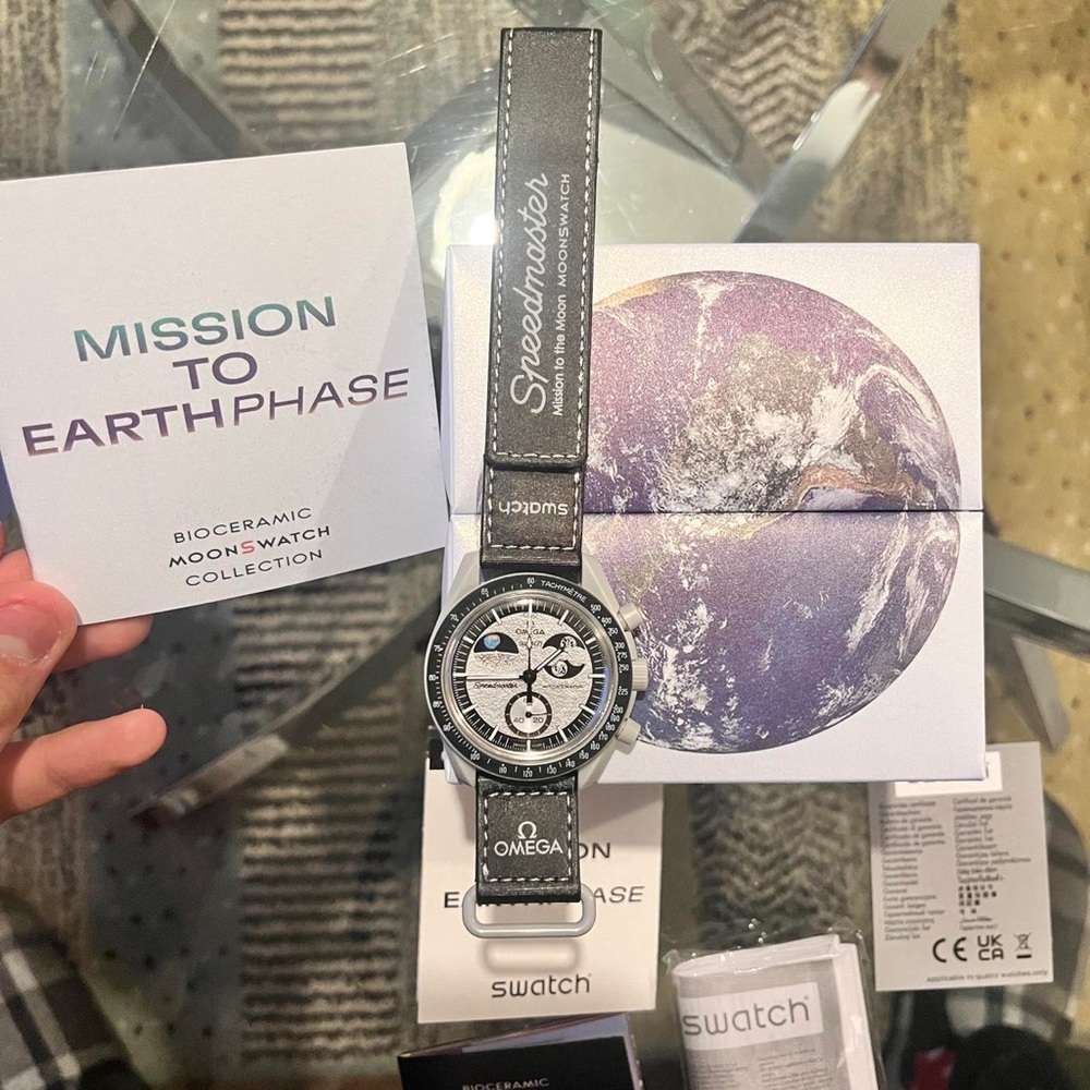 Omega Men's Silver and Black Watch